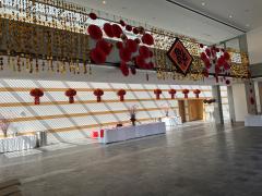 A decorated hall with red lanterns and accents.